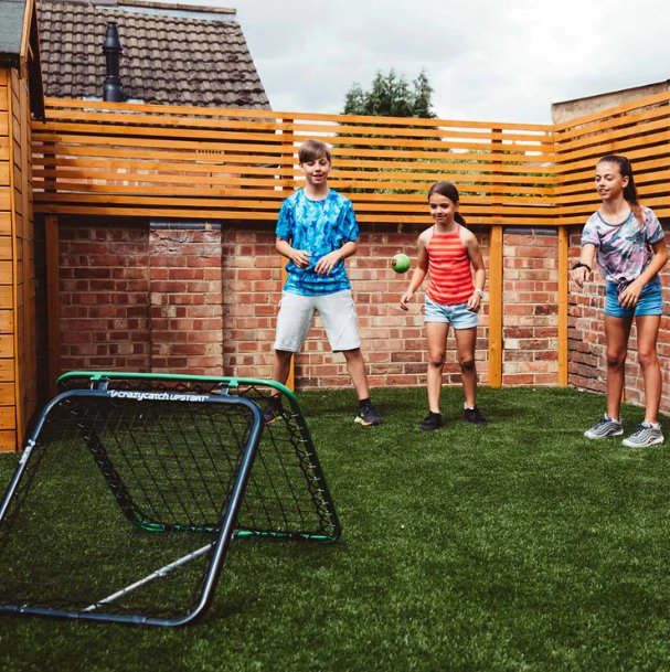 Crazy Catch Upstart 2.0 portable double-sided rebound net shown freestanding on grass for hand-eye coordination training