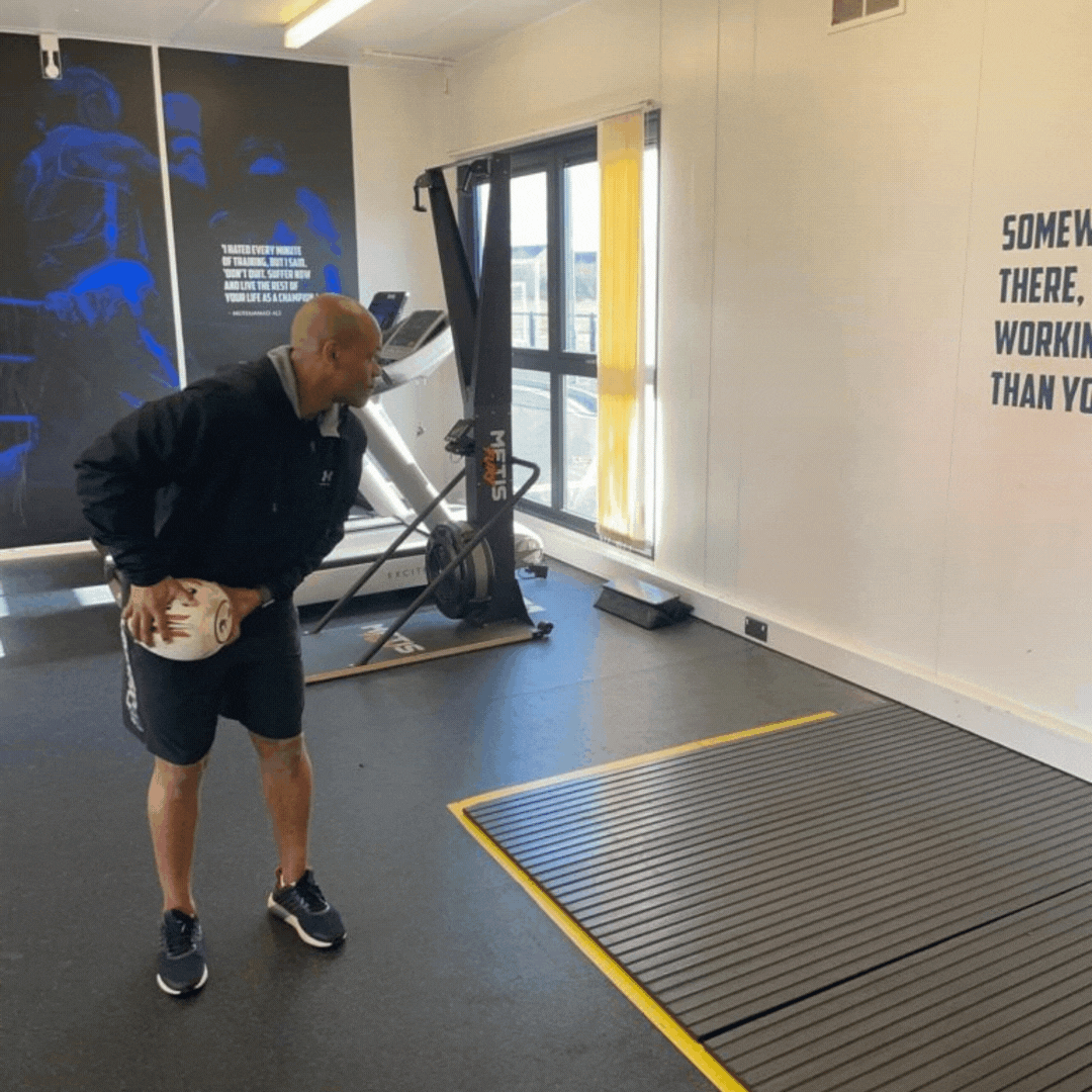 Ram Rugby Solo Skills Ball in red and white, designed for passing practice with a flat end for solo rugby training.