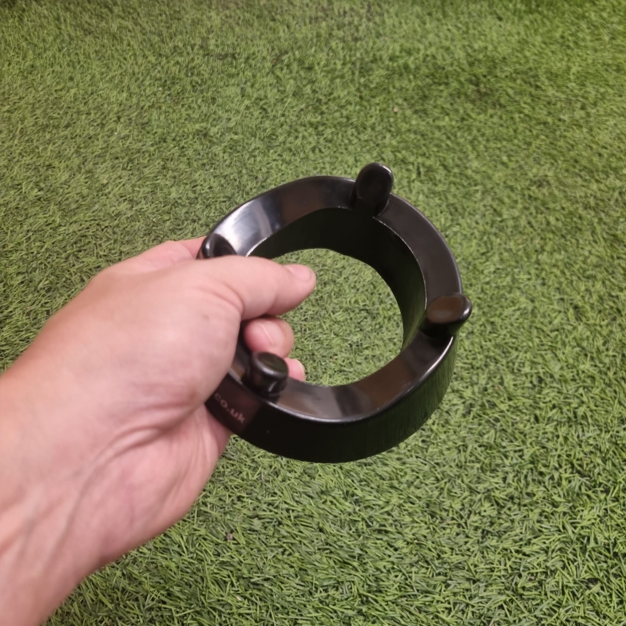 Ram Rugby black kicking tee with durable four-pronged 4cm design, heavy-duty moulded plastic for stable support.