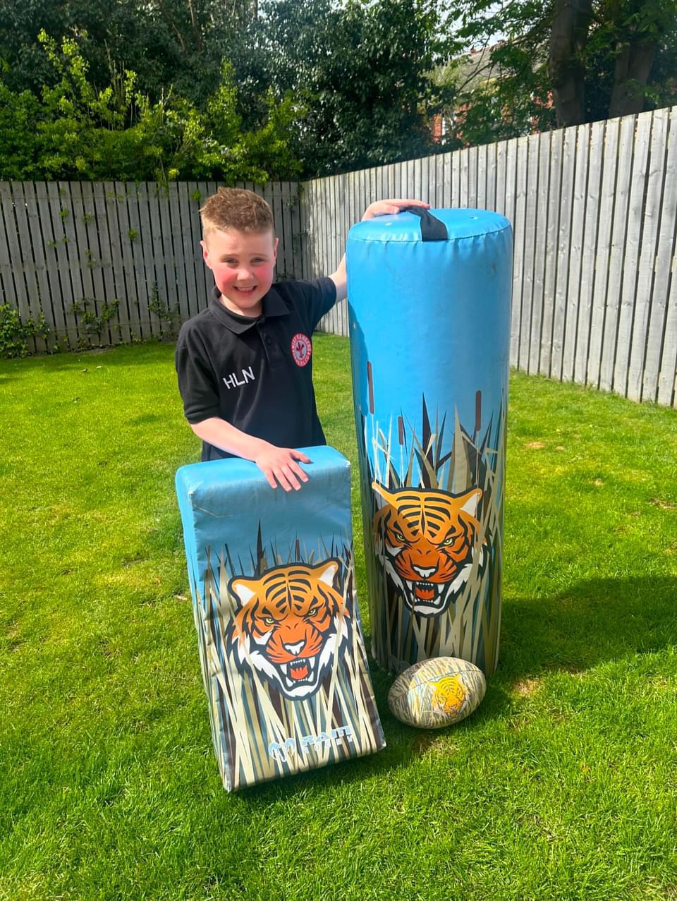 Ram Rugby Animal Design Curve Hit Shield showing curved black and orange contact pad for versatile rugby training