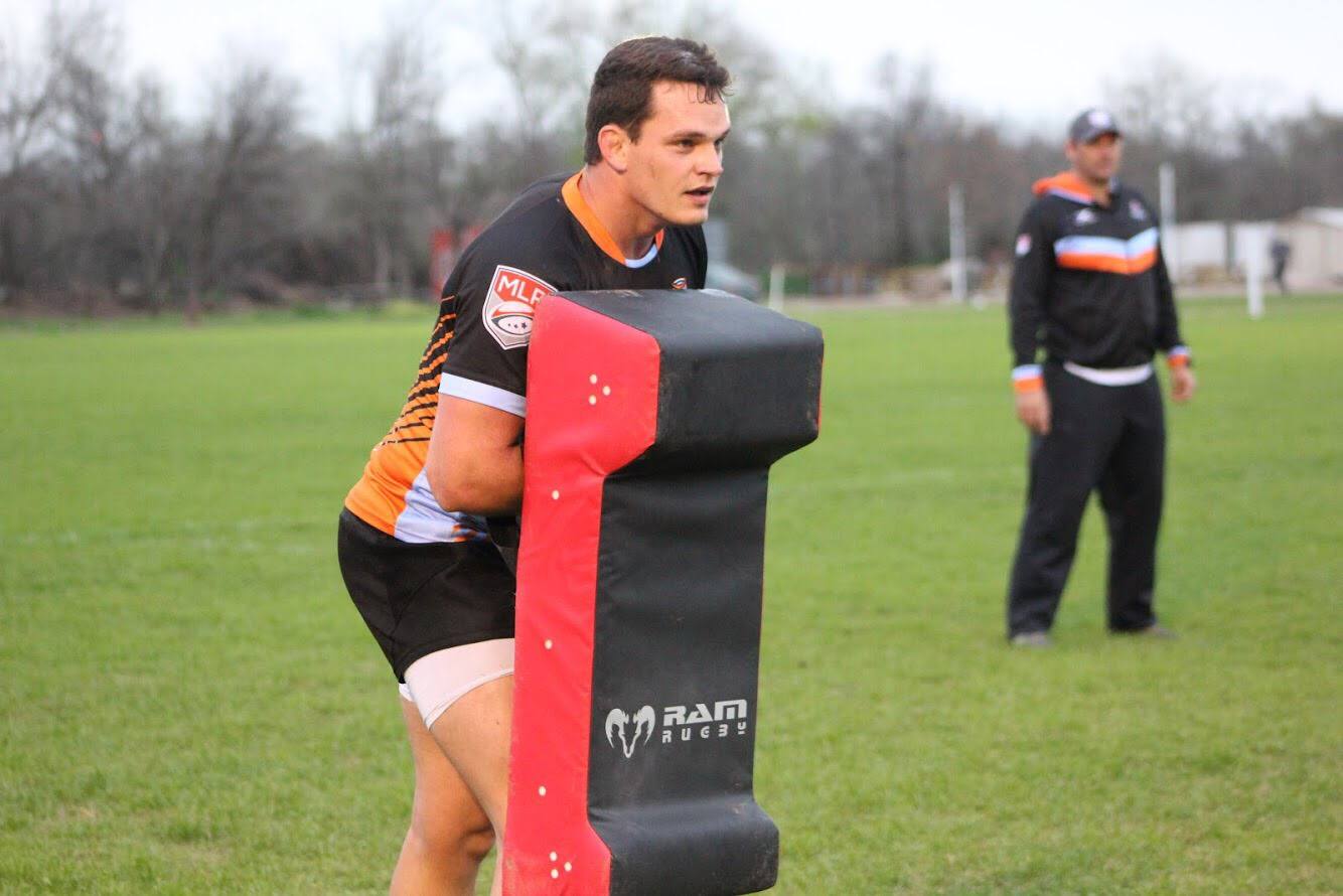 Ram Rugby Double Wedge Hit Shield in black and red with durable PVC and foam, designed for safe tackle practice impact absorption