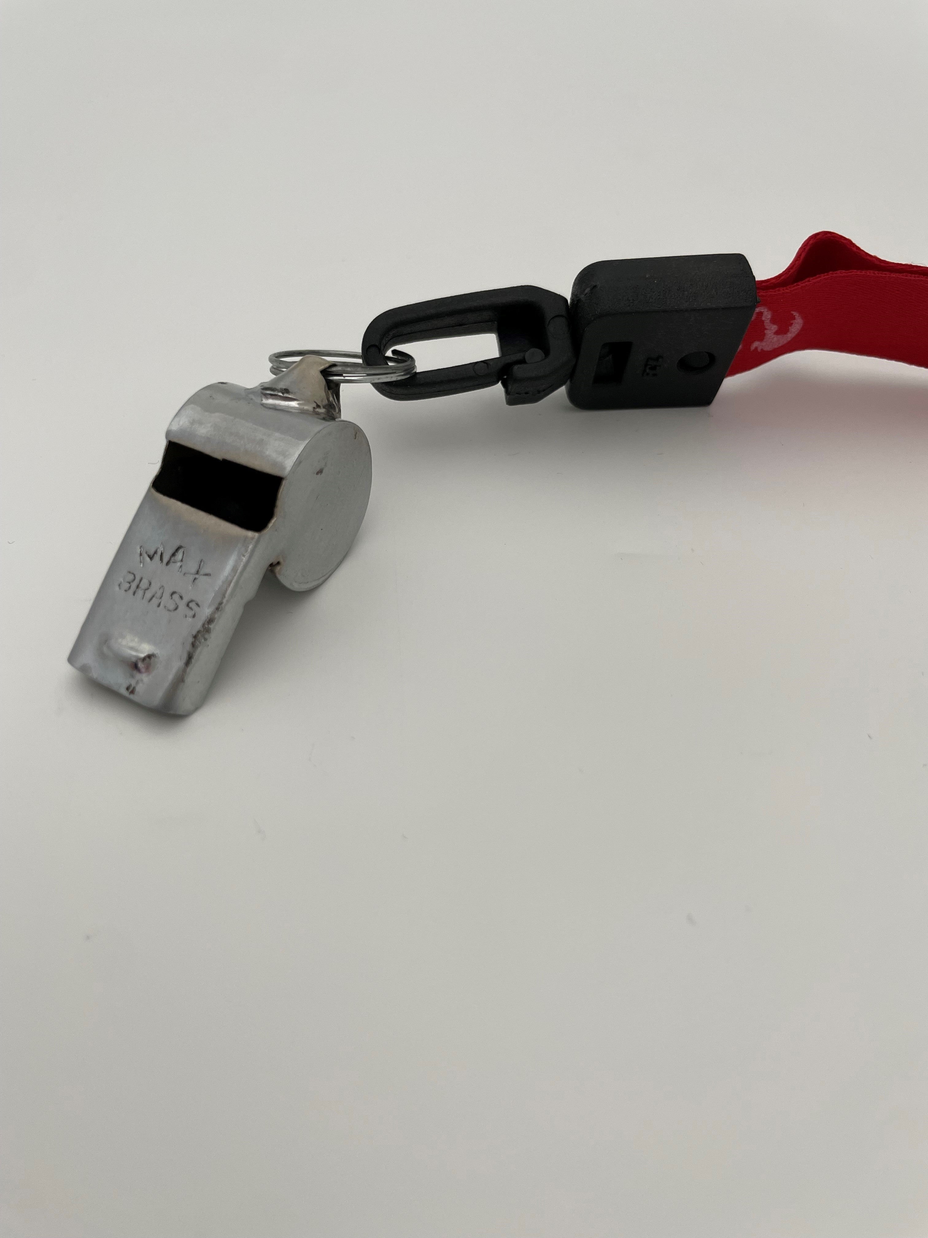 Ram Rugby metal whistle with durable silver design and bright red lanyard, ideal fitness and sports accessory for referees